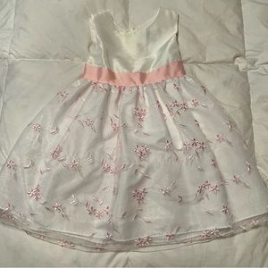 White dress with pink embroidered flowers throughout